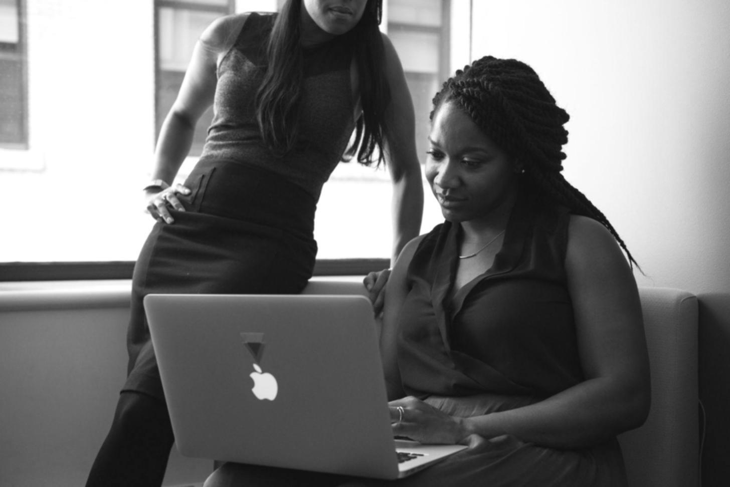 Business professionals analyzing financial data and decision trees on multiple screens